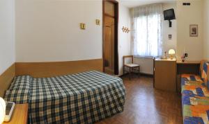 Postel nebo postele na pokoji v ubytování Villa Flora