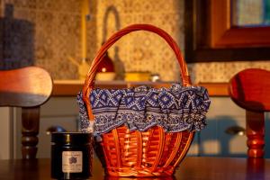 a basket sitting on a table next to a mug at Cabana Foxes' Shelter din Beliș, Apuseni in Călăţele +10 photos