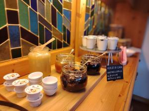 a table with jars of jam and jars of honey at Meublè Siesle in Sauris +3 photos
