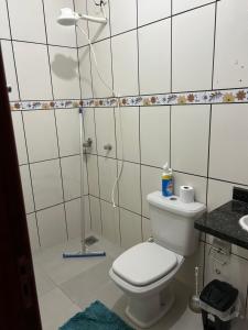 a bathroom with a toilet and a shower at Residência perto do auditório da Puc salão de assembleia TJ, in Goiânia