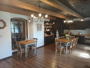a dining room with wooden tables and chairs at Domus Nö58 in Litomyšl