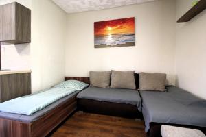 a couple of beds in a room at Áron Apartment in Nyíregyháza