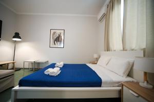 Letto o letti in una camera di Athenian Suite by Zeussuites