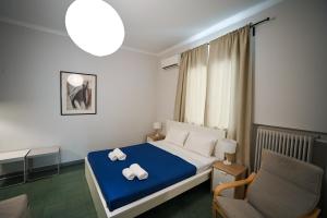 Letto o letti in una camera di Athenian Suite by Zeussuites