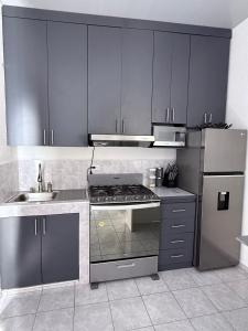 Køkken eller tekøkken på Tu refugio a pasos del centro comercial