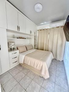 En eller flere senge i et værelse på Tu refugio a pasos del centro comercial