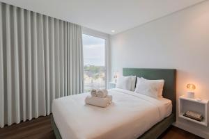 En eller flere senge i et værelse på Penthouse 9