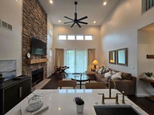 a living room with a couch and a fireplace at McHenry Riverside Retreat Comfort in McHenry