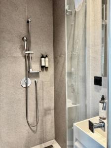 a bathroom with a shower and a sink at Comfy Apartments - Old Town Center in Gdańsk +36 photos
