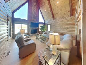 a living room with a couch and a table at Tranquil Cove in Sandy Ridge +38 photos
