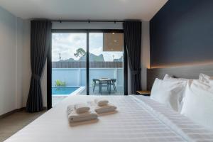 Katil atau katil-katil dalam bilik di Raintree922 Pool Villa Krabi +30 gambar