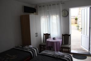 Μια τηλεόραση ή/και κέντρο ψυχαγωγίας στο Apartman Mima