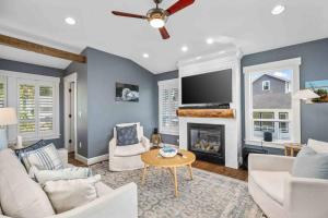 a living room with a couch and a fireplace at Nauti Beach Cottage in Lincoln City