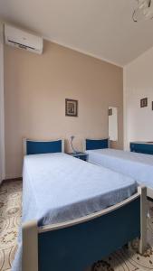Postel nebo postele na pokoji v ubytování Casa Serena by LoveSud