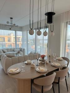 a dining room with a table and chairs at Luxurious Seaside Penthouse in Haapsalu