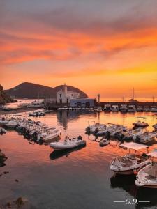 a group of boats in a marina at sunset at Via Roma 55 in Lipari