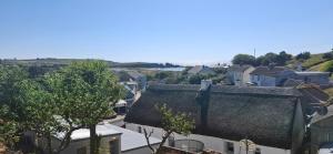 an overhead view of a city with houses and trees at Dairy Cottage Courtyard accommodation in Bunmahon