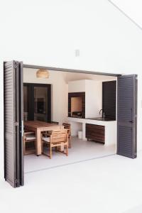 a kitchen with a table and a dining room at Villa Vicenta in Svetvinčenat +61 photos