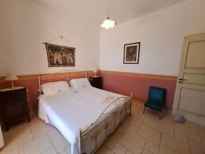 Ένα ή περισσότερα κρεβάτια σε δωμάτιο στο Villa Serracca