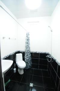 a bathroom with a toilet and a sink at Guest House Giorgi in Makhinjauri +41 photos