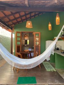 a hammock in the living room of a house at Canto Carauari Pousada in Alter do Chao +57 photos