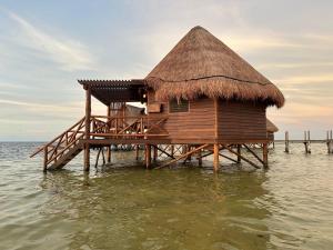 a small hut in the water in the ocean at LOB LOB Cabañas del mar in Dzilam de Bravo