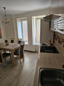 a kitchen and dining room with a table and a dining room at Summer Lounch in Liepāja