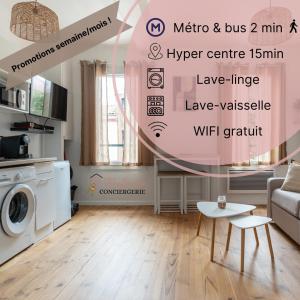 a living room with a washing machine and a table at Barrière naturelle in Toulouse