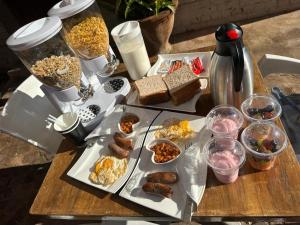 a table topped with plates of food on a table at KO'THABENG GUESTHOUSE in Lebowakgomo +32 photos