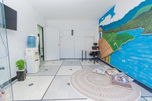 a room with a mural on the wall at Hostal Bendito, central y cómodo in Medellín