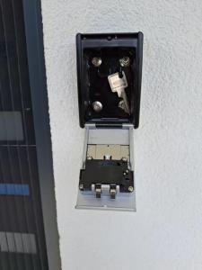 a black box on the side of a wall at FeWo Lupi in Stockach