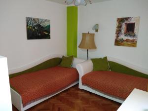 Postel nebo postele na pokoji v ubytování Apartmani Lucky