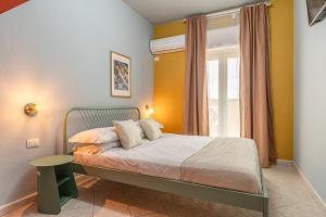 Ένα ή περισσότερα κρεβάτια σε δωμάτιο στο Barceloneta Experience Suite & Rooms