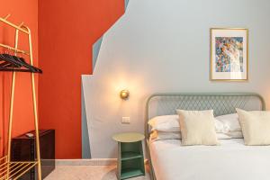 Ένα ή περισσότερα κρεβάτια σε δωμάτιο στο Barceloneta Experience Suite & Rooms