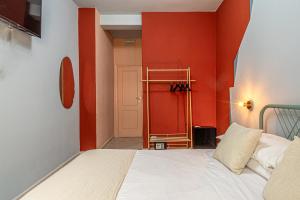 Ένα ή περισσότερα κρεβάτια σε δωμάτιο στο Barceloneta Experience Suite & Rooms
