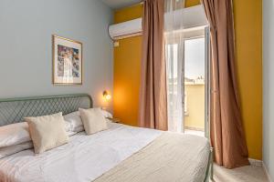 Ένα ή περισσότερα κρεβάτια σε δωμάτιο στο Barceloneta Experience Suite & Rooms