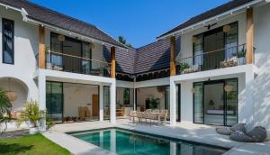 an exterior view of a house with a swimming pool at Terrene Villa in Weligama