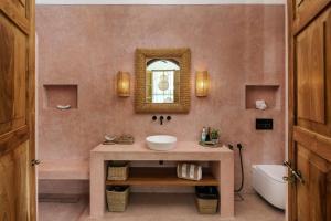 a bathroom with a sink and a mirror at Terrene Villa in Weligama +38 photos