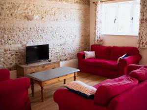 Et tv og/eller underholdning på Newfield Farm Cottages