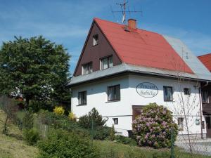 a white house with a red roof at Penzion Babička, pokoj A in Trojanovice