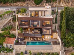 an aerial view of a house with a swimming pool at Villa Atreeum in Dubrovnik