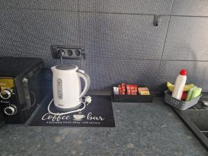 a coffee maker sitting on top of a counter at TURCOAZ Studio in Costinesti