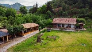an aerial view of a house with a yard at Casuta de sub deal 