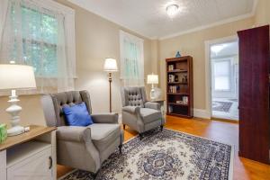 a living room with two chairs and a table at 2-Acre Property Victorian Home in Brownville! in Brownville