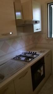 A kitchen or kitchenette at Le Querce Santa Cesarea Terme