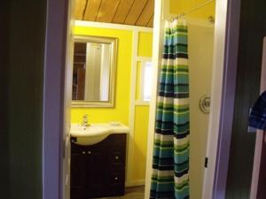 a bathroom with a sink and a mirror at Nimpo Lake Resort in Nimpo Lake +65 photos