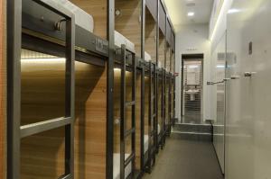 a row of lockers in a hallway at Capsule Hotel Capsula in Moscow