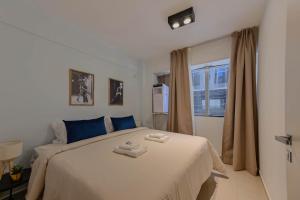 Postel nebo postele na pokoji v ubytování MOT Mansion Mitre 'D' - 4 pax Gym & Jacuzzi