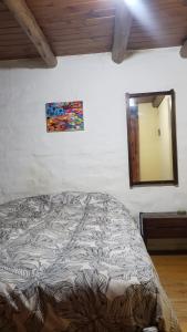 Postel nebo postele na pokoji v ubytování Casa de Montaña, Lujan de Cuyo zona de bodegas