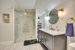 a bathroom with a shower and a sink at Dock and 2-Story Boat Slip Badin Lake Cabin in New London +37 photos